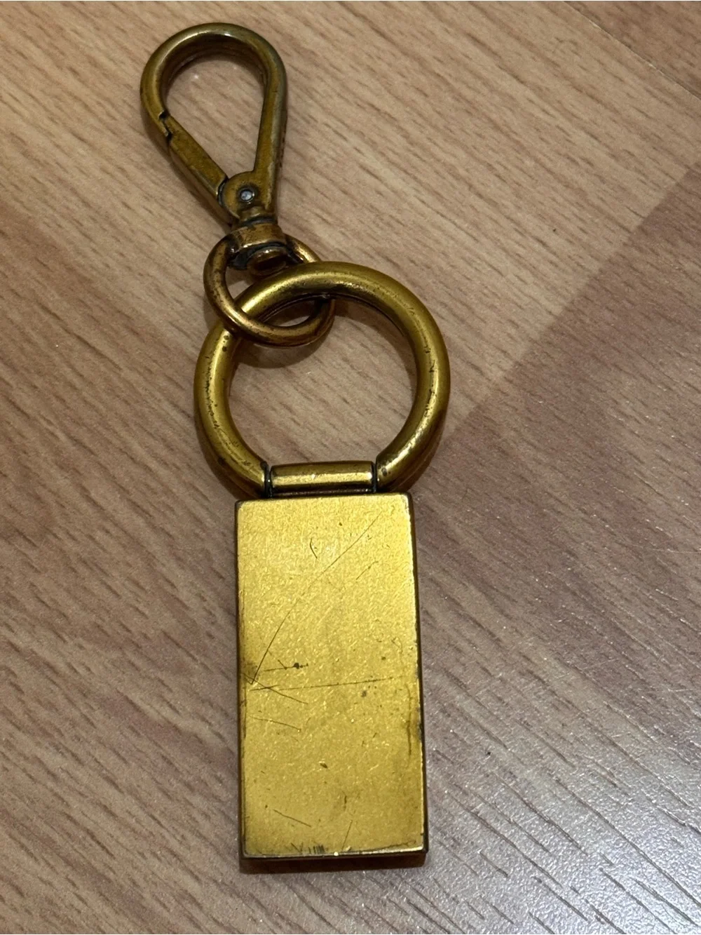 Vintage Prada Brass-Tone Logo Keychain in Gold